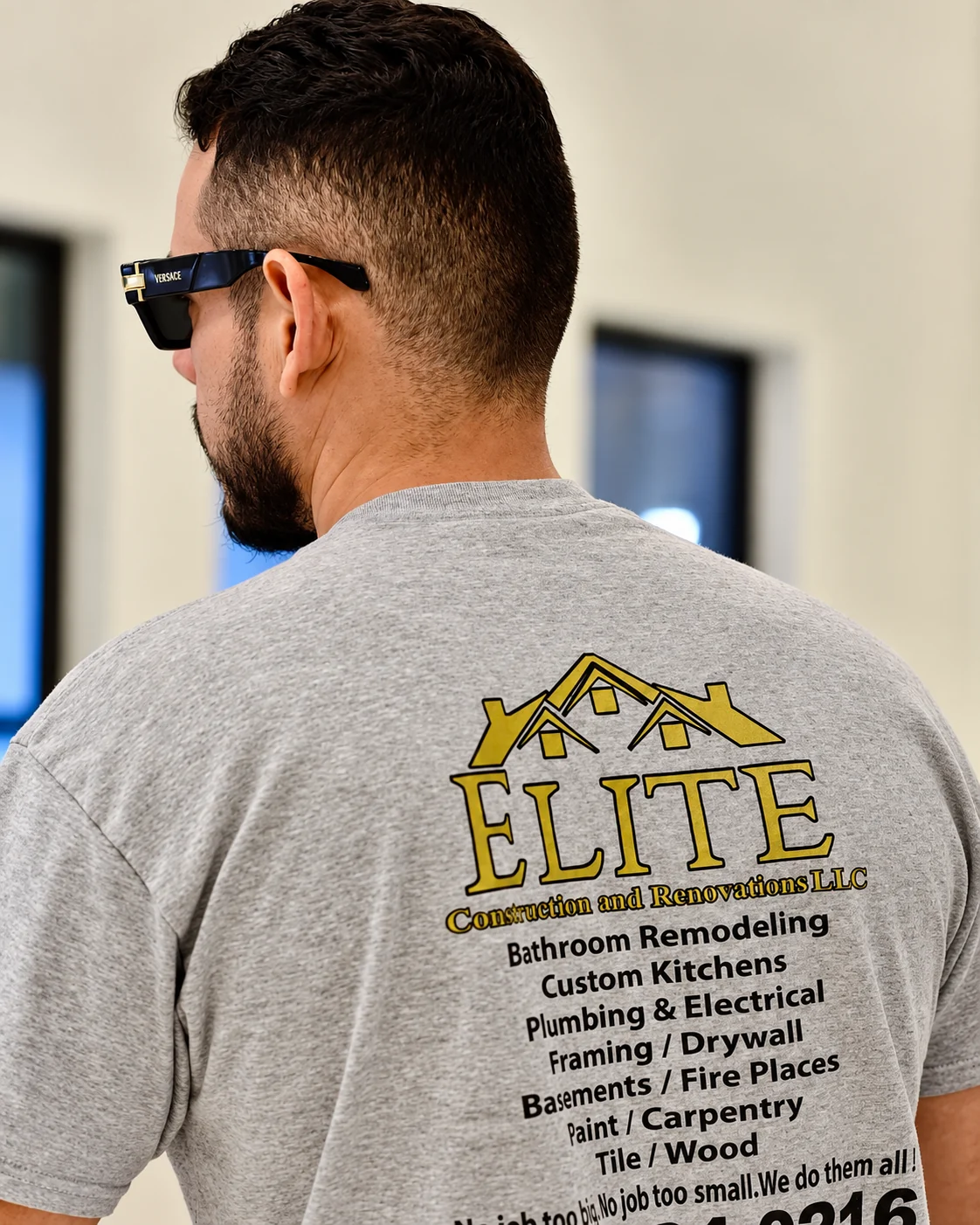 An Elite team member wearing the company shirt on site
